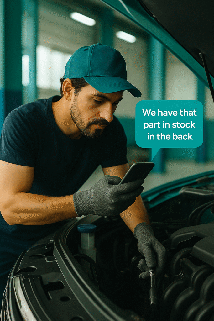 Mechanic checking inventory on phone with help from Max AI